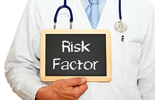 Doctor holding Risk Factor sign